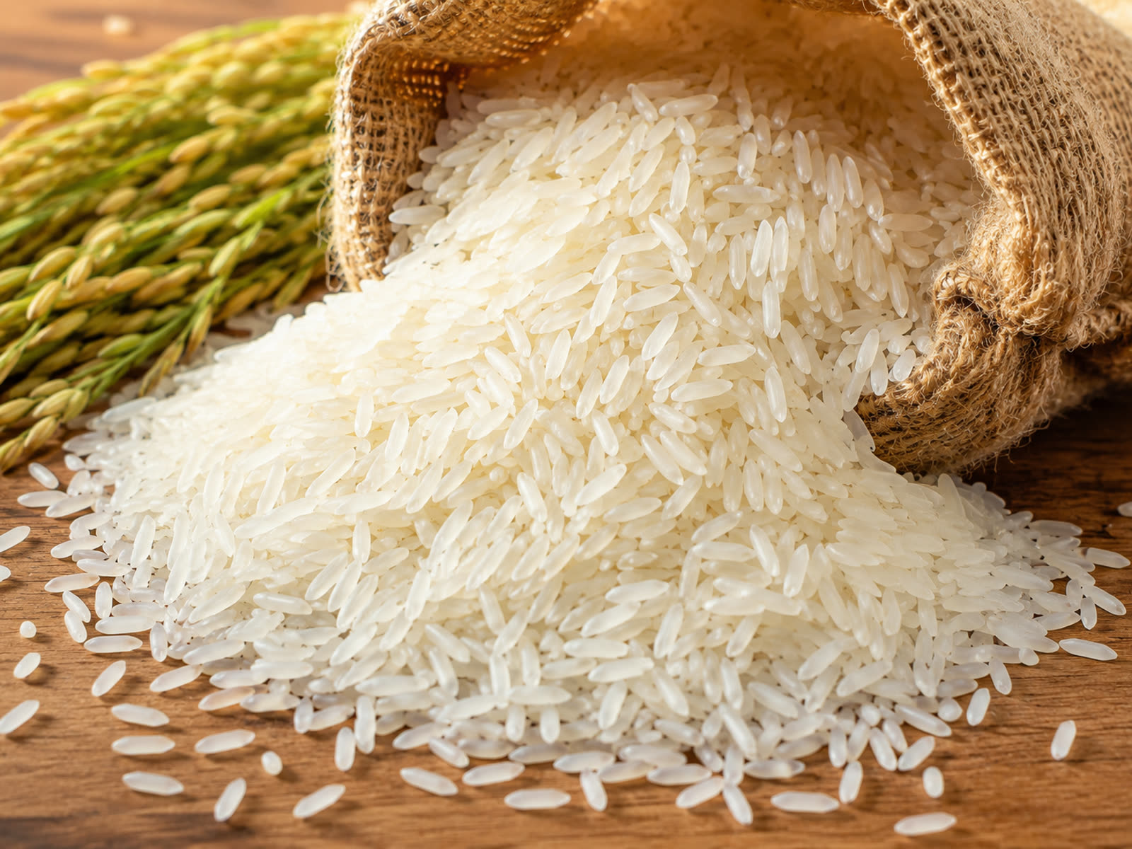 Premium Sona Masoori rice spilling from a jute sack