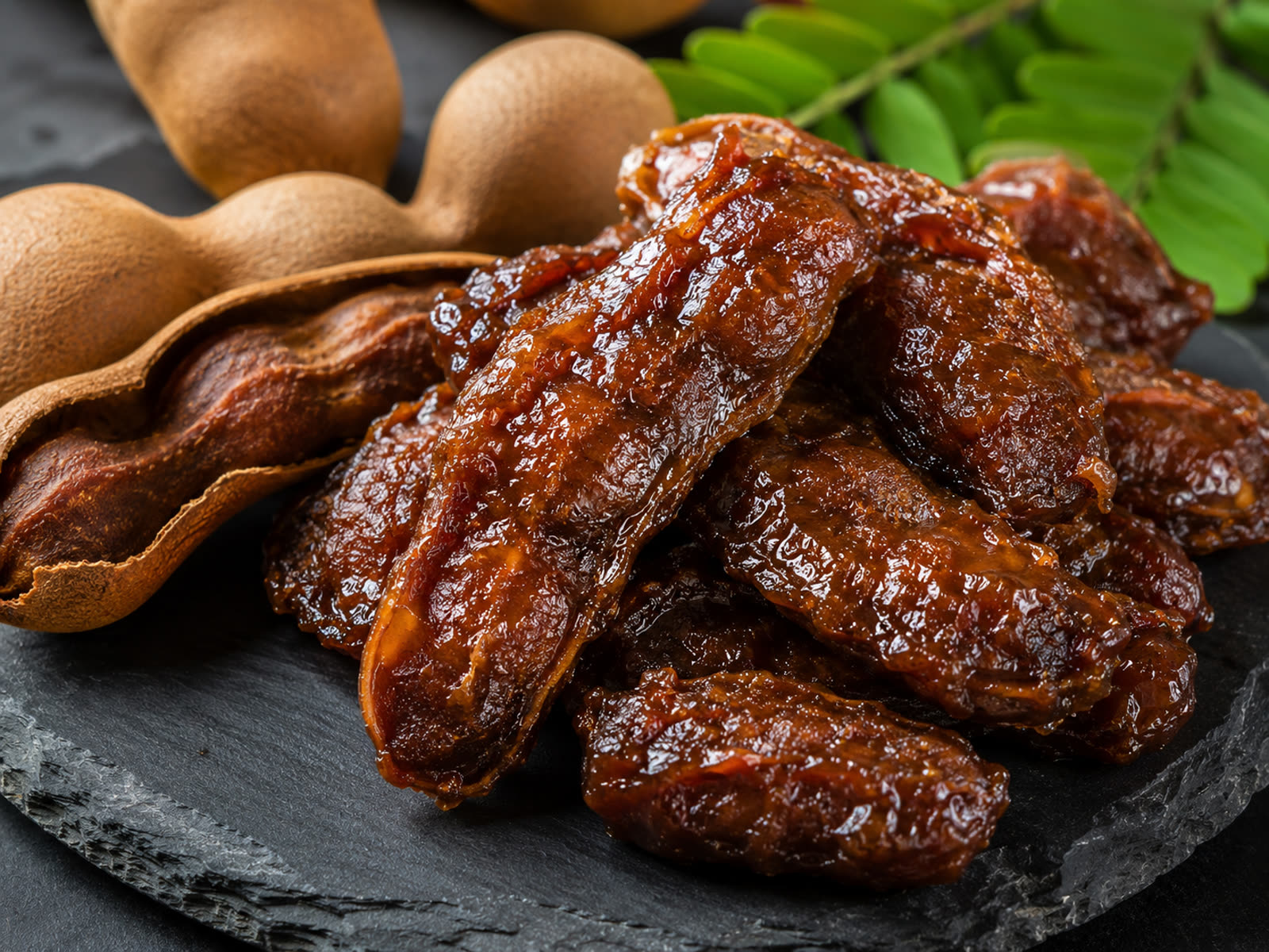 Deseeded semi-dried tamarind pulp with tamarind pods